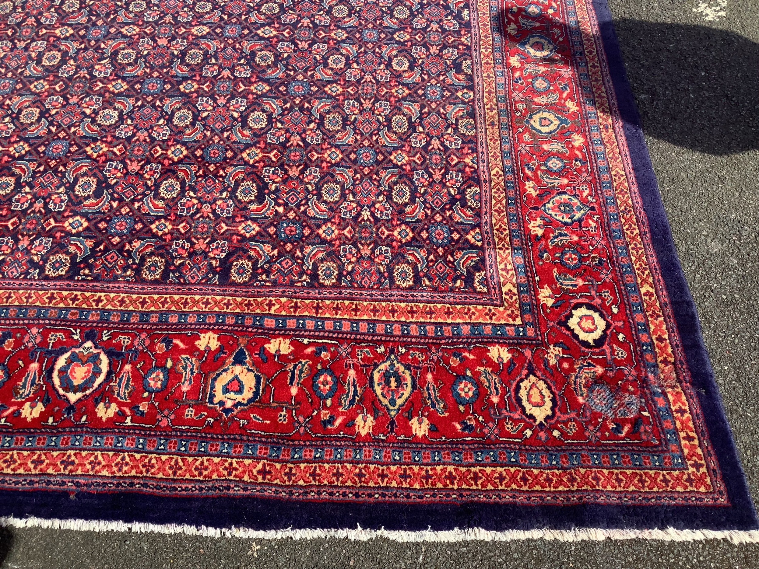 A North West Persian blue ground carpet, 534 x 325cm